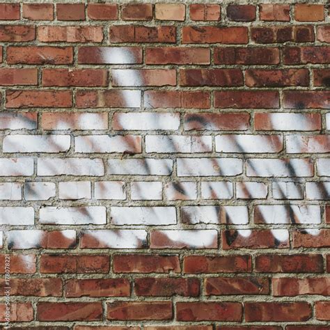 Graffiti on brick building wall Stock Photo | Adobe Stock