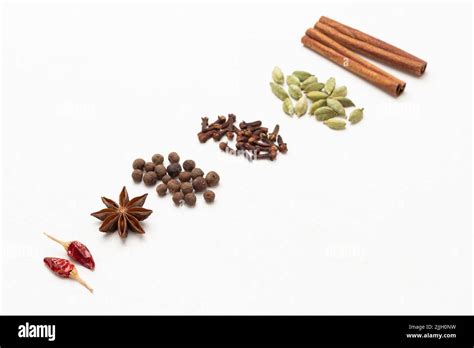 Spices Lie In A Row Diagonally Across The Frame Cinnamon Sticks