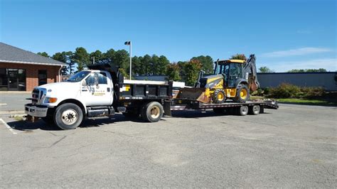 Firstcall Environmental Dump Truck With Backoe First Call Environmental