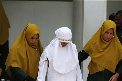 Photos Of Indonesian Woman Flogged Mercilessly In Public For Having Sex Outside Marriage