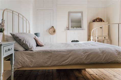 Light Bedroom With Iron Bed And Vintage Accents A Pared Back Minimal Stylish Period Two Bed