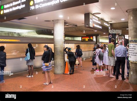 Passengers Wait To Board A Train At The Gallery Place Metro Station In