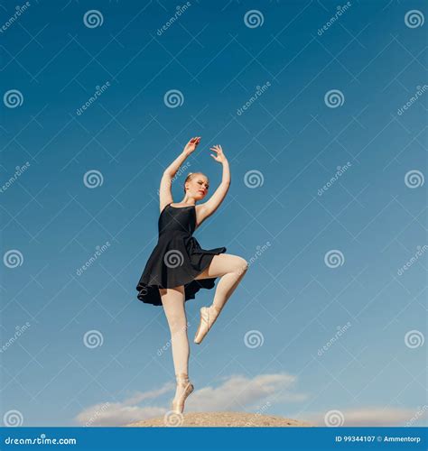 Female Ballet Dancer Practicing Dance Moves on a Rock Top Stock Image ...