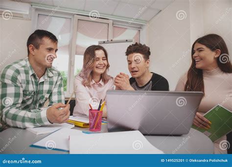 Group Of Young People Studying Together At College Classroom Stock