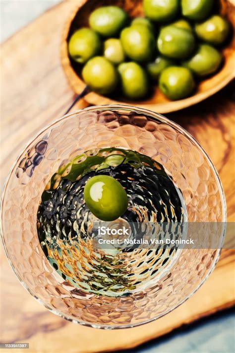 Martini Cocktail With Green Olive Stock Photo - Download Image Now ...