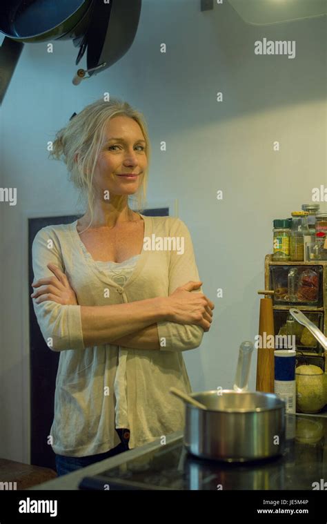 Mature Woman Cooking At Home Portrait Stock Photo Alamy