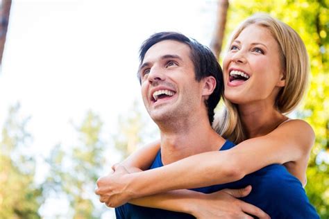 Premium Photo Happy To Be Together Low Angle View Of Happy Young Loving Couple Standing