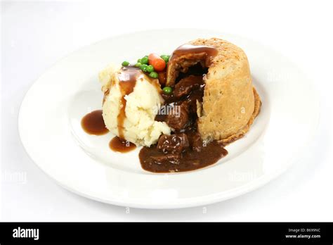 Steak pie with gravy Stock Photo - Alamy