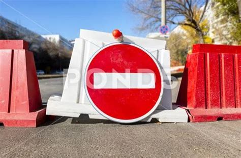 Photograph Red No Entry Traffic Sign On The Closed Road 168495692