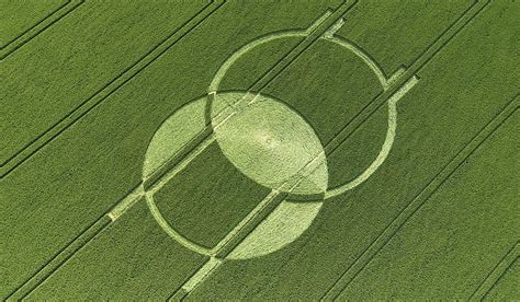 an aerial view of a green field with a circle drawn on it