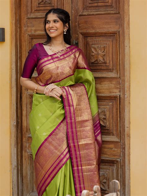 Handwoven Green Kanjeevaram Silk Saree With Pink Border