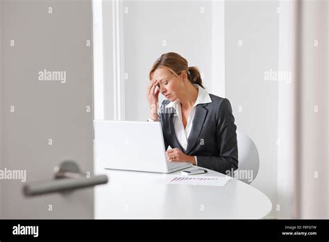 Stressed Businesswoman Working In Office Stock Photo Alamy