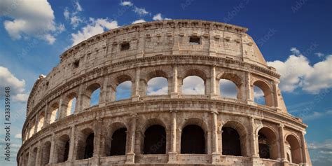 Detail of the arches of the Colosseum. Marble ruins over a blue sky, Rome, Italy Stock Photo ...