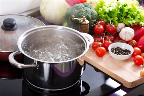 Boiling Water in a Cooking Pot on the Cooker Stock Photo - Image of ...