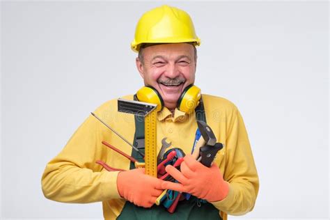 Laughing Senior Hispanic Plumber Holding Tools in Hands. Stock Image ...