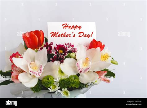 Happy Mothers Day Text On T Card In Flower Bouquet On White