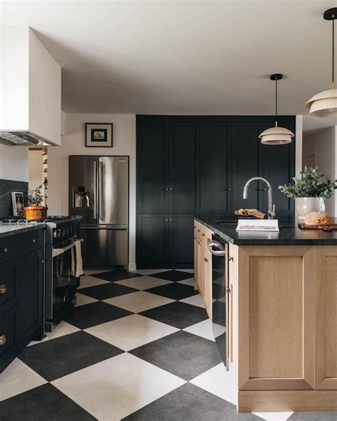 Checkered floor kitchen with an arched entrance in Quebec City, Quebec, Canada. By Blanc Marine ...