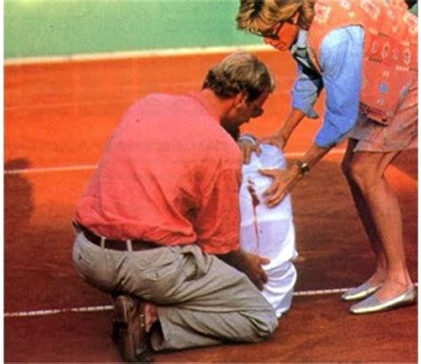 Two Men And A Woman On A Tennis Court