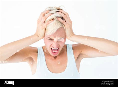 Angry Blonde Woman Screaming And Holding Her Head Stock Photo Alamy