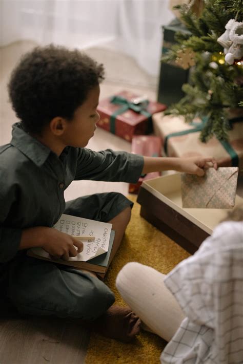 A Kid Sitting on the Floor · Free Stock Photo