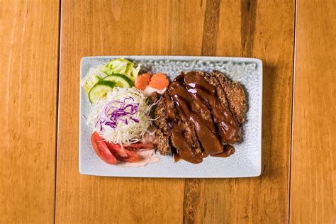 Close-Up Shot of Delicious Korean Food in Ceramic Plate · Free Stock Photo