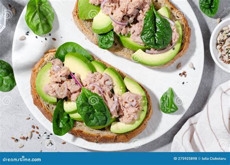 Tuna Avocado Toasts Healthy Snack Or Breakfast On Bright Background