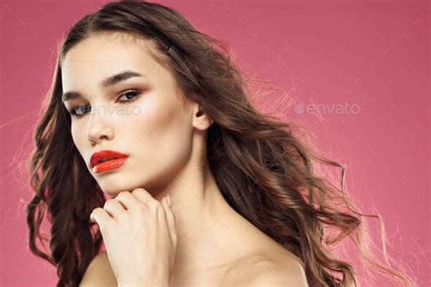 Beautiful Woman With Red Lips On A Pink Background Nude Shoulders