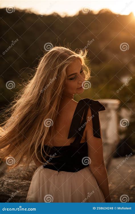 Blonde Long Hair Nature Summer Happy Adult Girl With Long Blond Hair Developing In The Wind In