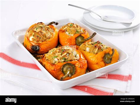 Oven-roasted stuffed peppers Stock Photo - Alamy