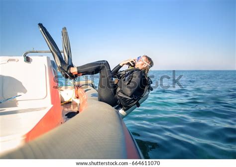 Scuba Diver Jumping Water Boat Stock Photo Edit Now 664611070