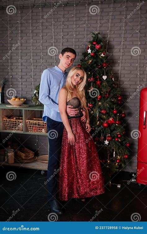 A Girl In A Beautiful Dress Hugs And Kisses A Guy New Yearand X27 S