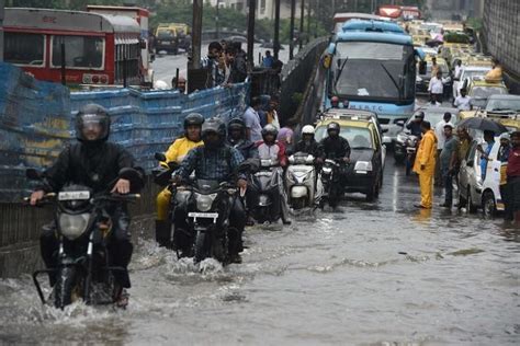 Heavy Rains Batter Indias Mumbai Disrupting Air Rail Traffic The