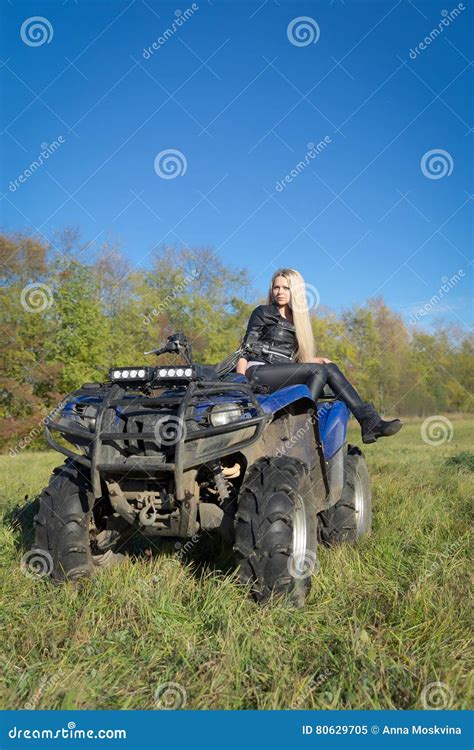 Elegant Blonde Woman Riding Extreme Quadrocycle Atv On Summer Field