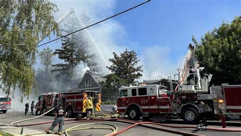 Crews battle house fire in Woodland, PG&E temporarily cuts power