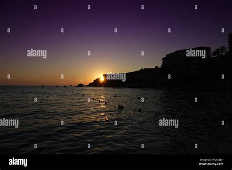 sunset at golden bay malta Stock Photo - Alamy