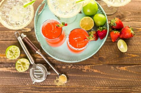 Premium Photo Classic Lime And Strawberry Margaritas On The Rocks