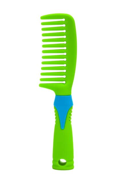 Premium Photo | Green plastic comb