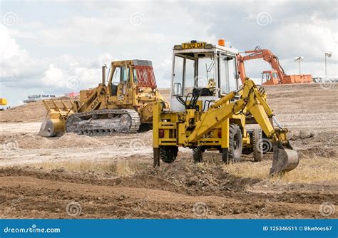 A Digger S Moving Soil Editorial Photo Image Of Excavating 125346511