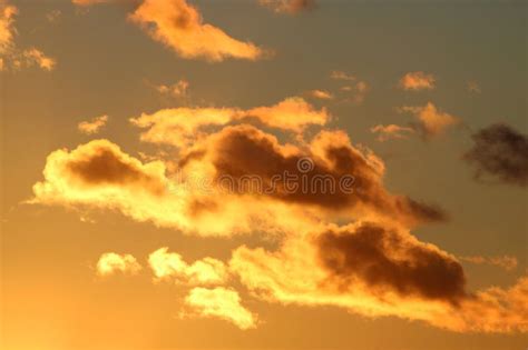 Golden Colors on Clouds in Sky at Sunset Stock Photo - Image of ...