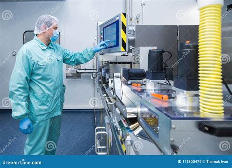 Pharmacy Industry Factory Man Worker In Protective Clothing In Sterile