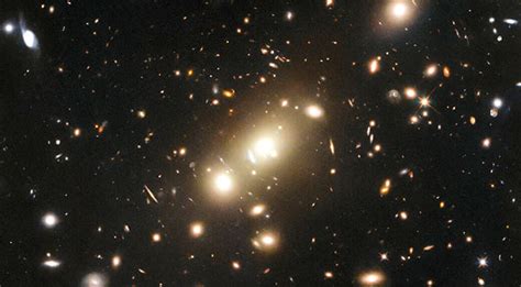 Photo Of The Day Nasa S Hubble Space Telescope Spots Cosmic Cluster