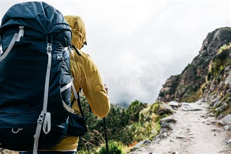 Portrait Of Solo Hiker Wearing Professional Backpack Walk Across Foggy