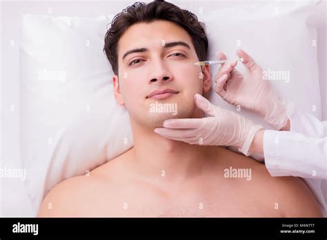 Handsome Man In Spa Massage Concept Stock Photo Alamy