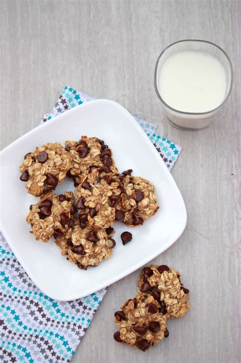 Oatmeal Cookies With Chocolate Chips On A Plate Next To A Glass Of Milk