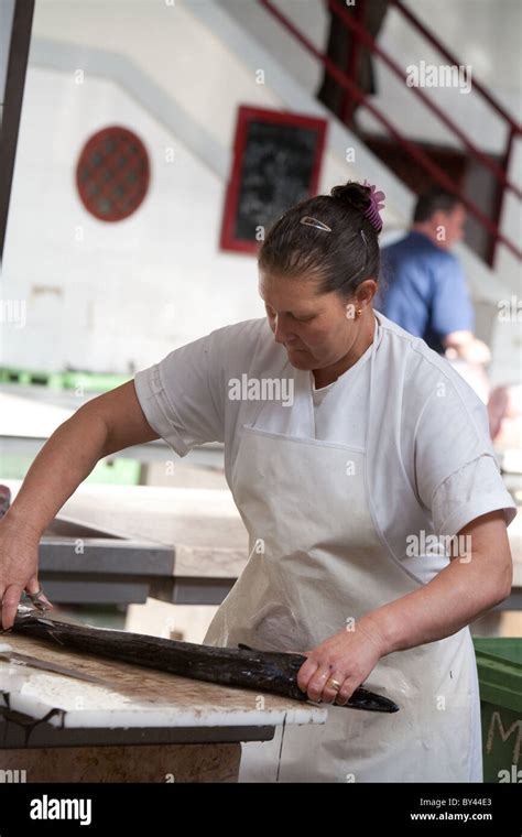 Woman Fishmonger Preparing Fish At Funchal Fish Market Madeira Stock