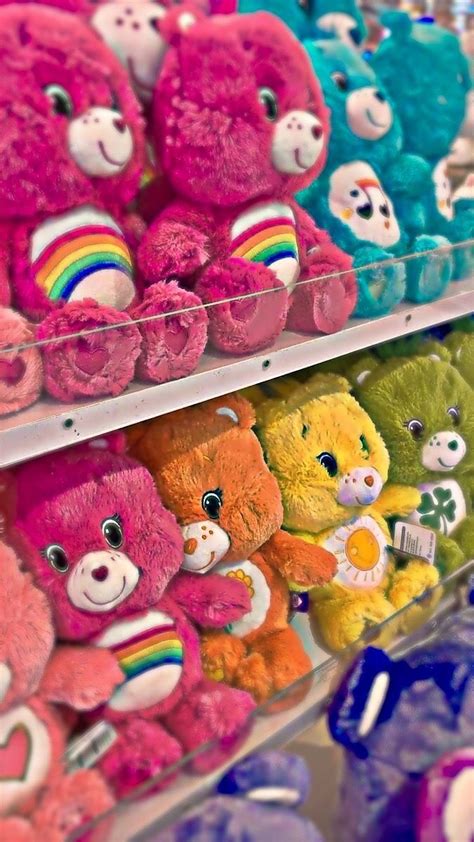 Many Different Colored Teddy Bears On Display In A Store