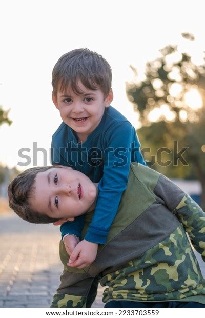 Two Happy Children Hugging Each Other Stock Photo 2233703559 | Shutterstock