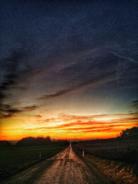 Premium Photo | Country road at sunset