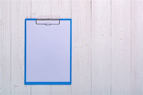 Premium Photo Clipboard With Blank White Paper Sheet On Wood