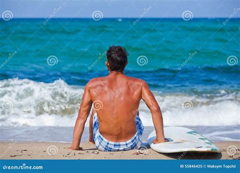 Man With His Surfboard On The Beach Stock Image Image Of Holding